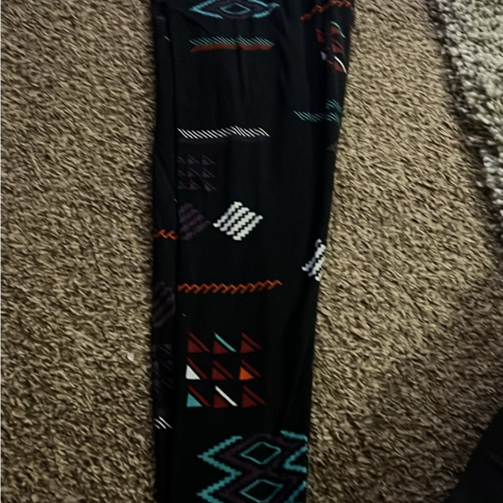 Lularoe Legging black with a design they are size tall and Curvy